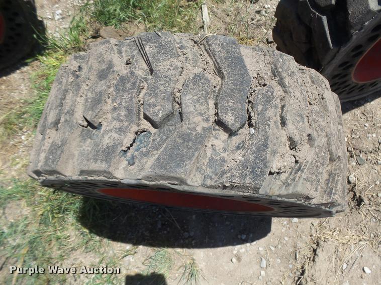 image for item DE9049 (4) 31x6x10/10-16.5 solid skid steer tires and wheels