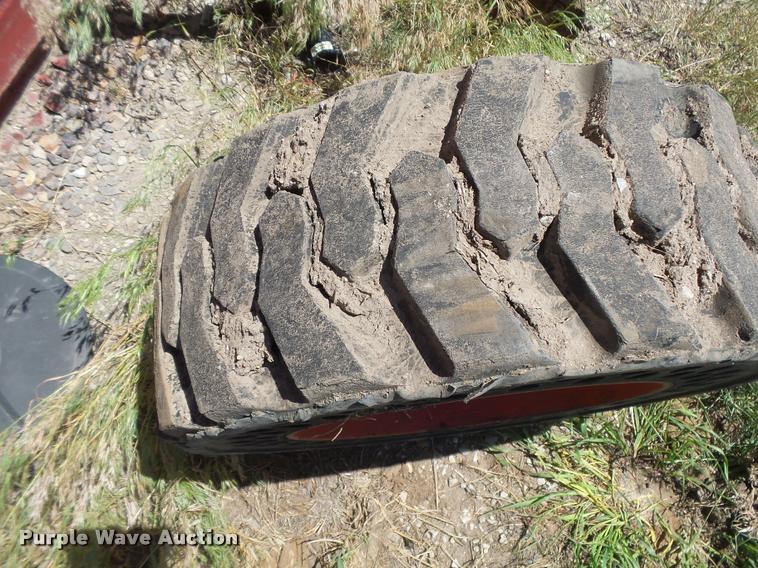 image for item DE9049 (4) 31x6x10/10-16.5 solid skid steer tires and wheels