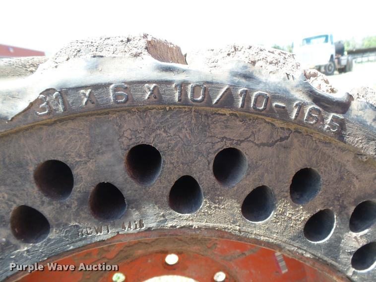 image for item DE9049 (4) 31x6x10/10-16.5 solid skid steer tires and wheels