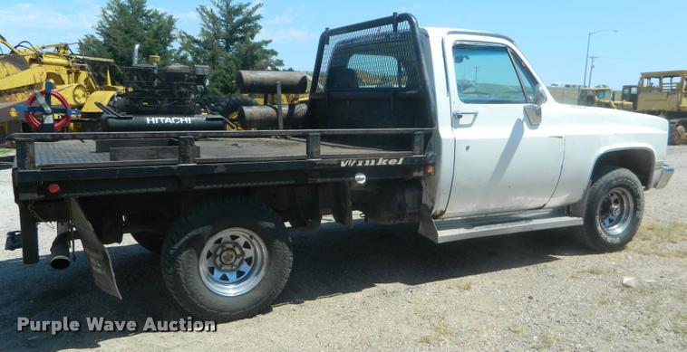 image for item DB1063 1983 Chevrolet 1500 flatbed pickup truck