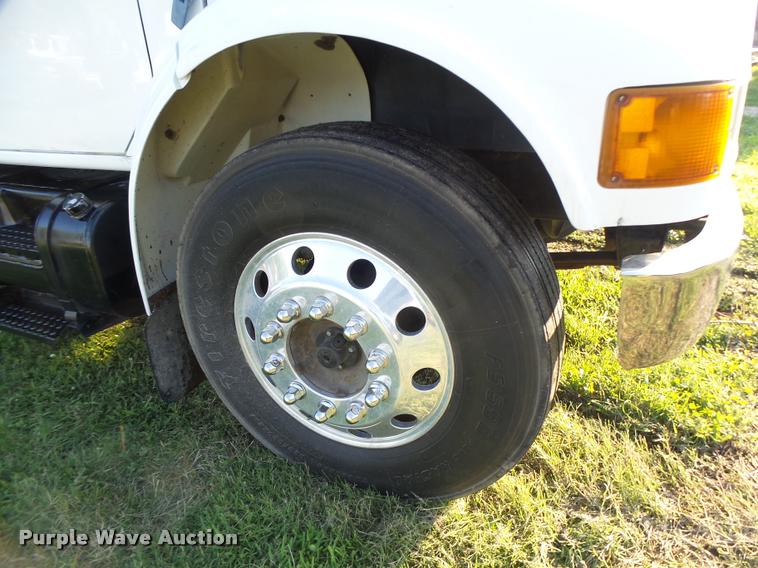 image for item DB1396 1999 International 4700 flatbed truck