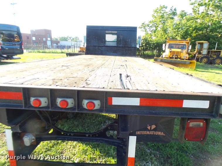 image for item DB1396 1999 International 4700 flatbed truck