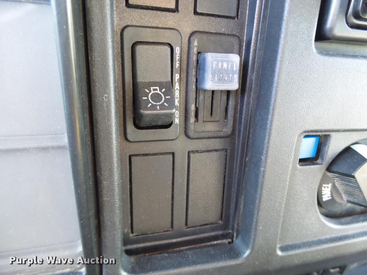 image for item DB1396 1999 International 4700 flatbed truck