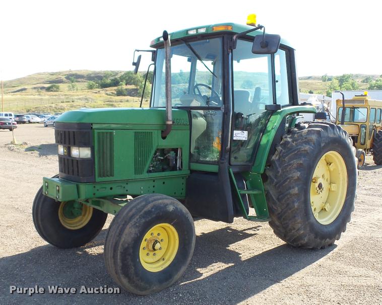 image for item DA1121 2001 John Deere 6310 tractor