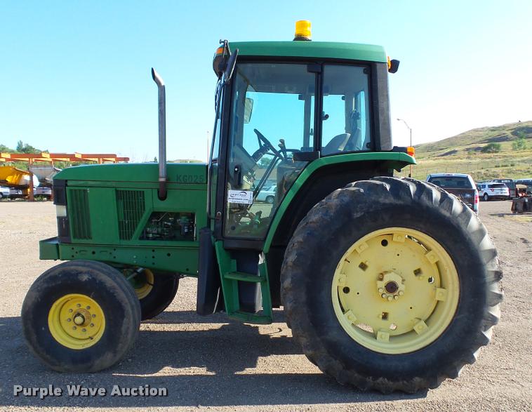 image for item DA1121 2001 John Deere 6310 tractor