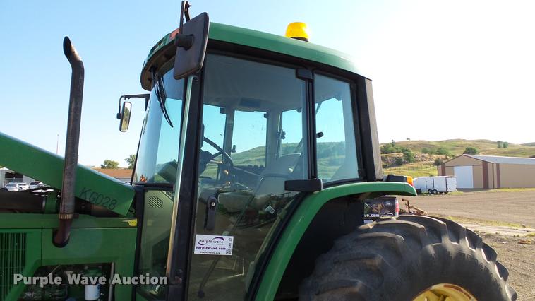 image for item DA1122 2001 John Deere 6310 tractor