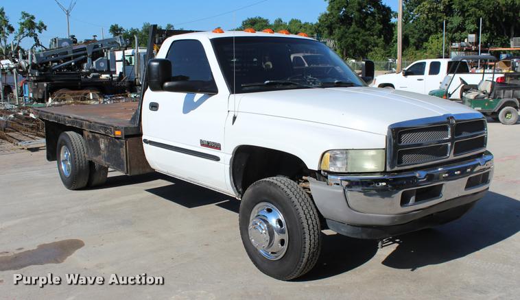 image for item L3177 2002 Dodge Ram 3500 SLT flatbed pickup truck