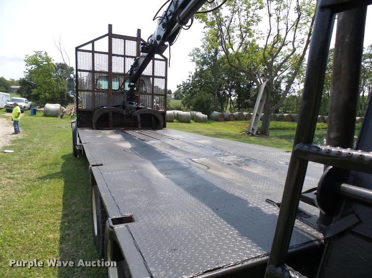 image for item K1846 2003 Sterling L9500 grapple crane truck