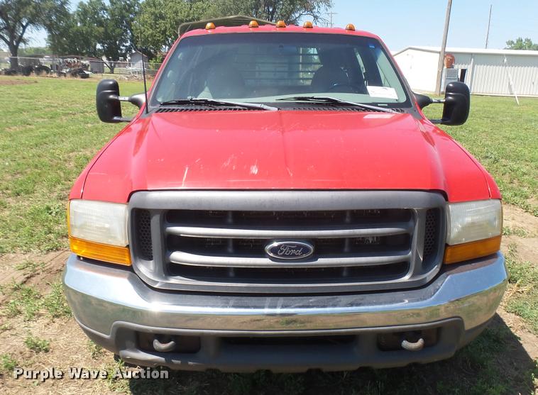 image for item DB3377 1999 Ford F350 Super Duty Crew Cab flatbed pickup truck