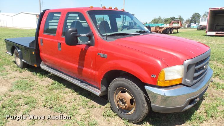 image for item DB3377 1999 Ford F350 Super Duty Crew Cab flatbed pickup truck