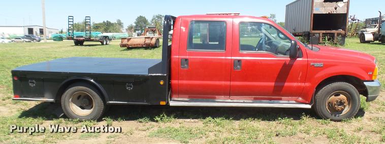 image for item DB3377 1999 Ford F350 Super Duty Crew Cab flatbed pickup truck