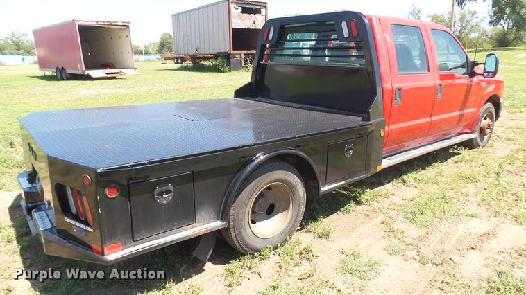 image for item DB3377 1999 Ford F350 Super Duty Crew Cab flatbed pickup truck