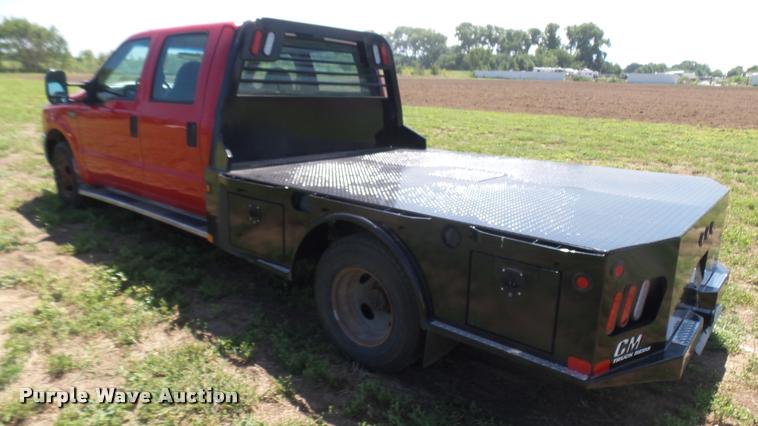 image for item DB3377 1999 Ford F350 Super Duty Crew Cab flatbed pickup truck