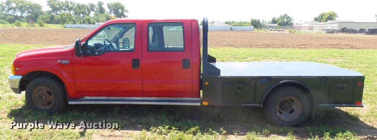 image for item DB3377 1999 Ford F350 Super Duty Crew Cab flatbed pickup truck