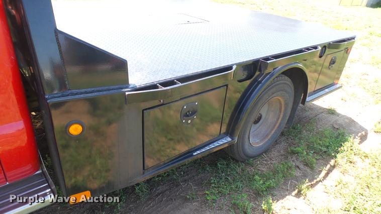 image for item DB3377 1999 Ford F350 Super Duty Crew Cab flatbed pickup truck