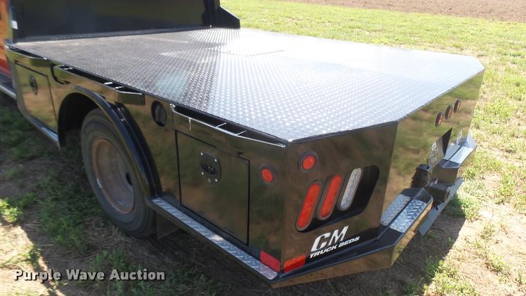 image for item DB3377 1999 Ford F350 Super Duty Crew Cab flatbed pickup truck