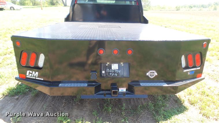 image for item DB3377 1999 Ford F350 Super Duty Crew Cab flatbed pickup truck