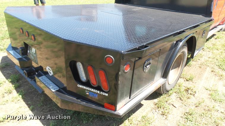 image for item DB3377 1999 Ford F350 Super Duty Crew Cab flatbed pickup truck