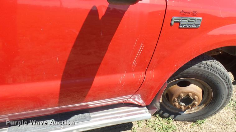 image for item DB3377 1999 Ford F350 Super Duty Crew Cab flatbed pickup truck