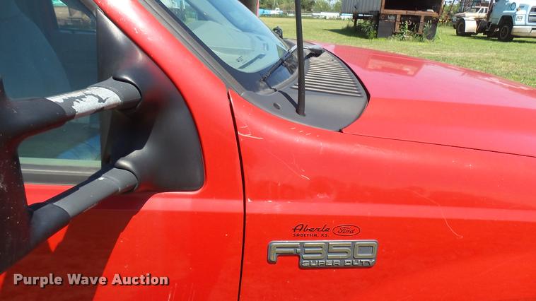 image for item DB3377 1999 Ford F350 Super Duty Crew Cab flatbed pickup truck