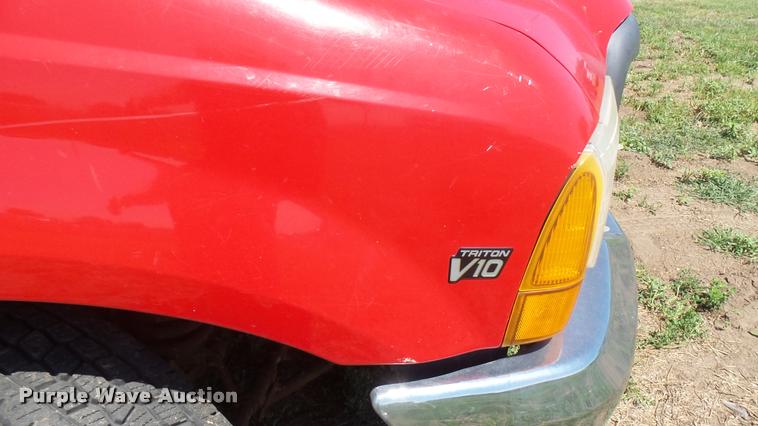 image for item DB3377 1999 Ford F350 Super Duty Crew Cab flatbed pickup truck