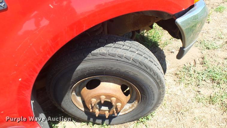 image for item DB3377 1999 Ford F350 Super Duty Crew Cab flatbed pickup truck