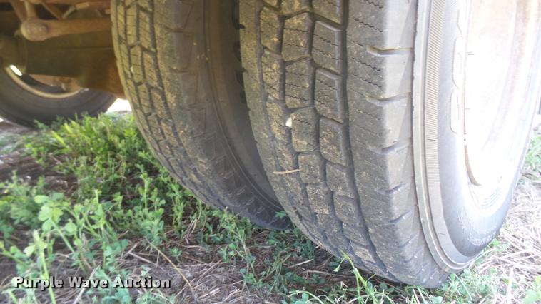 image for item DB3377 1999 Ford F350 Super Duty Crew Cab flatbed pickup truck