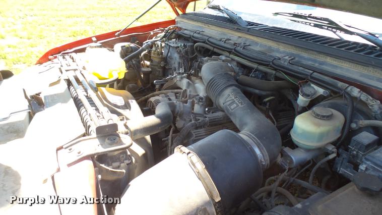 image for item DB3377 1999 Ford F350 Super Duty Crew Cab flatbed pickup truck