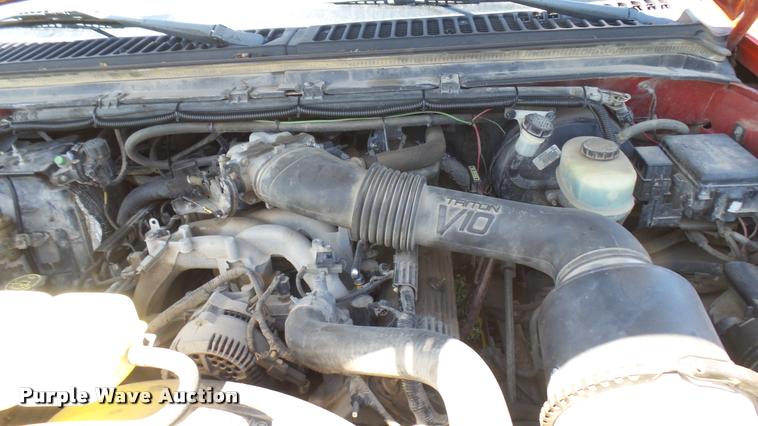 image for item DB3377 1999 Ford F350 Super Duty Crew Cab flatbed pickup truck