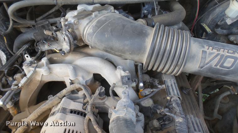 image for item DB3377 1999 Ford F350 Super Duty Crew Cab flatbed pickup truck