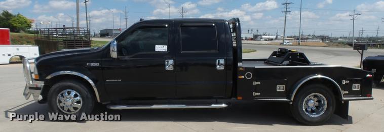 image for item DC3979 2003 Ford F350 Super Duty XLT Lariat Edge Crew Cab flatbed pickup truck