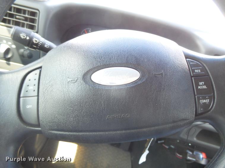 image for item DC3979 2003 Ford F350 Super Duty XLT Lariat Edge Crew Cab flatbed pickup truck