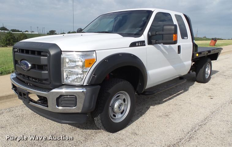 image for item DL9032 2014 Ford F250 Super Duty SuperCab flatbed pickup truck