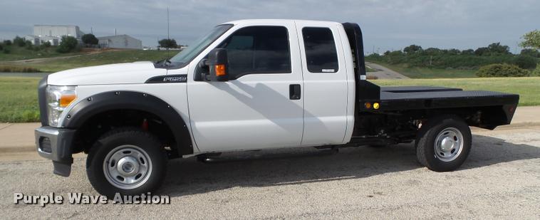 image for item DL9032 2014 Ford F250 Super Duty SuperCab flatbed pickup truck