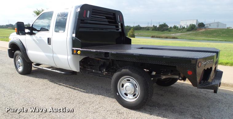image for item DL9032 2014 Ford F250 Super Duty SuperCab flatbed pickup truck