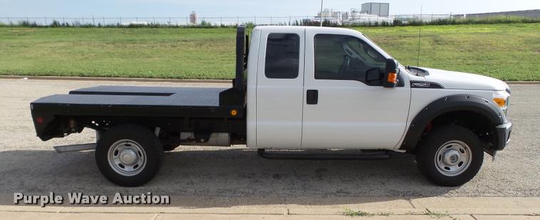 image for item DL9032 2014 Ford F250 Super Duty SuperCab flatbed pickup truck