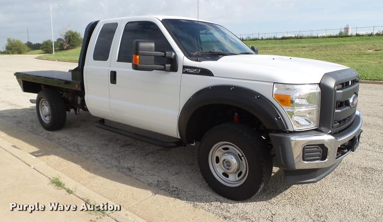 image for item DL9032 2014 Ford F250 Super Duty SuperCab flatbed pickup truck