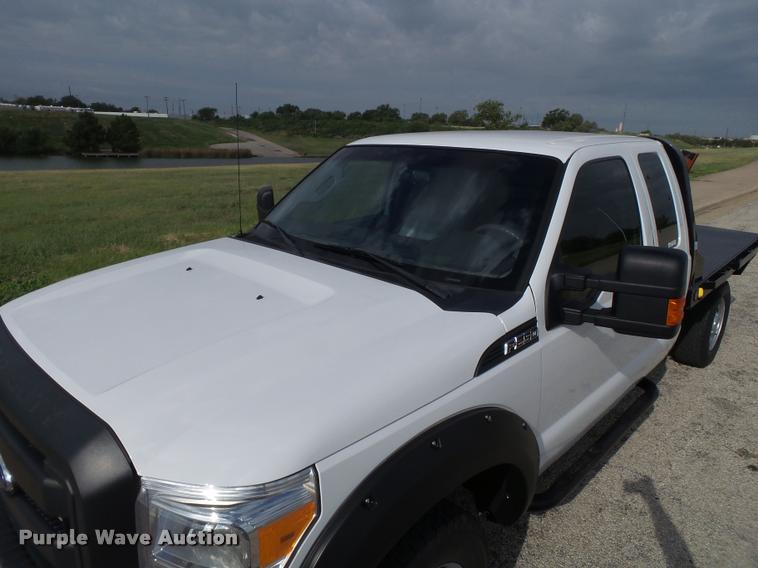 image for item DL9032 2014 Ford F250 Super Duty SuperCab flatbed pickup truck