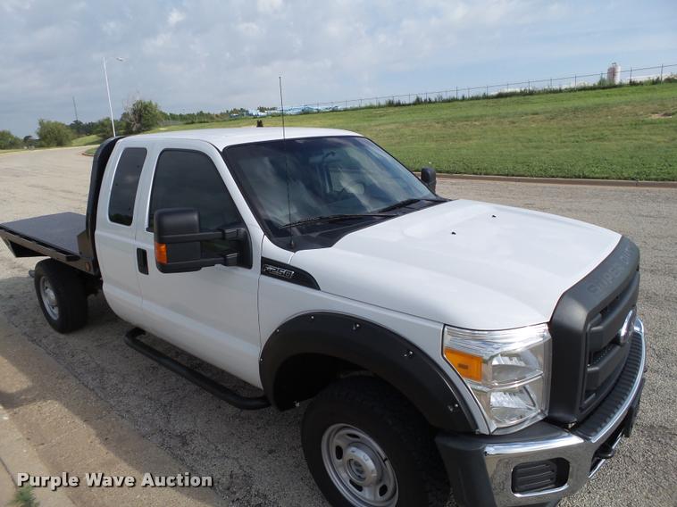 image for item DL9032 2014 Ford F250 Super Duty SuperCab flatbed pickup truck