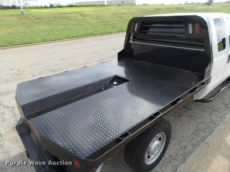 image for item DL9032 2014 Ford F250 Super Duty SuperCab flatbed pickup truck
