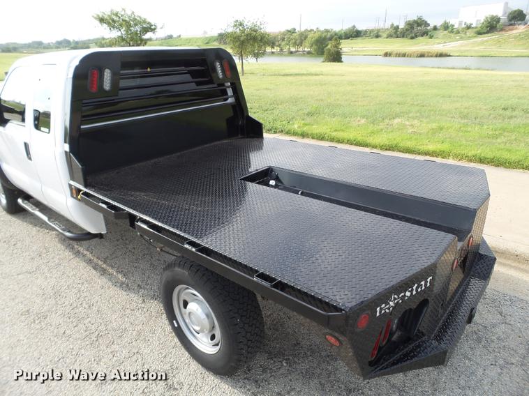 image for item DL9032 2014 Ford F250 Super Duty SuperCab flatbed pickup truck