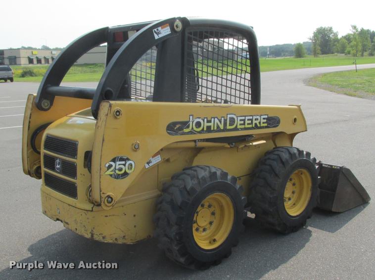 image for item K6116 2002 John Deere 250 skid steer
