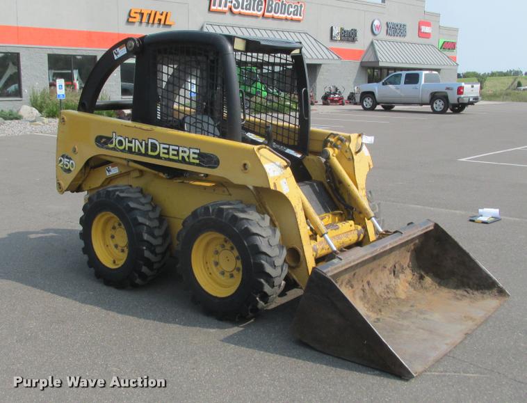 image for item K6116 2002 John Deere 250 skid steer