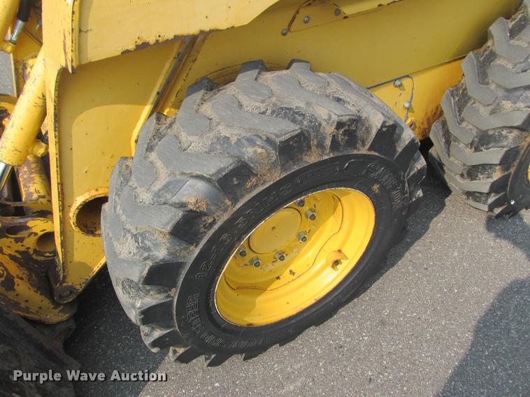 image for item K6116 2002 John Deere 250 skid steer