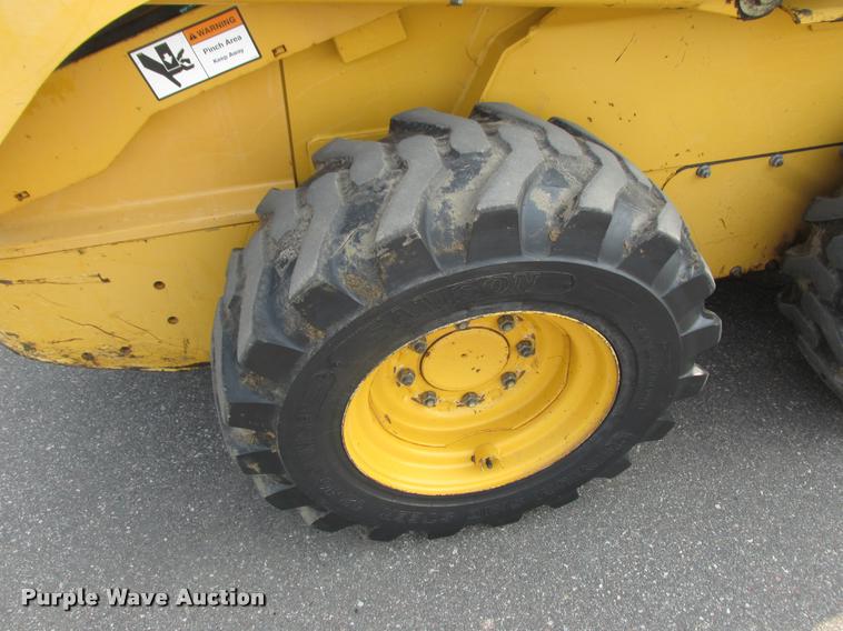 image for item K6116 2002 John Deere 250 skid steer