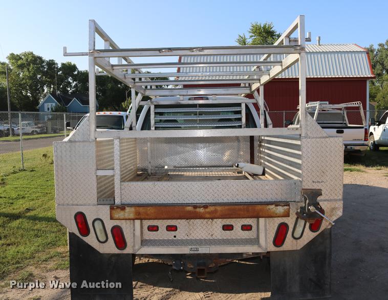 image for item DD0196 1999 Ford F350 Super Duty Crew Cab flatbed pickup truck