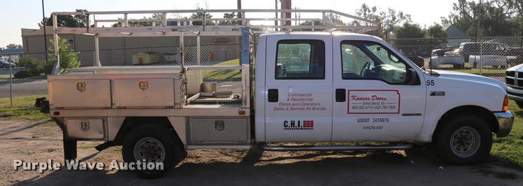 image for item DD0196 1999 Ford F350 Super Duty Crew Cab flatbed pickup truck