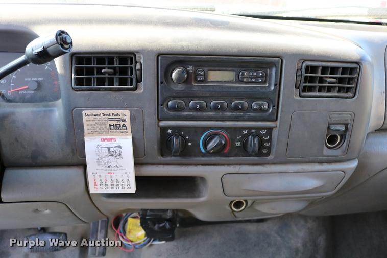 image for item DD0196 1999 Ford F350 Super Duty Crew Cab flatbed pickup truck