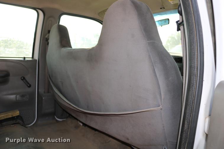 image for item DD0196 1999 Ford F350 Super Duty Crew Cab flatbed pickup truck