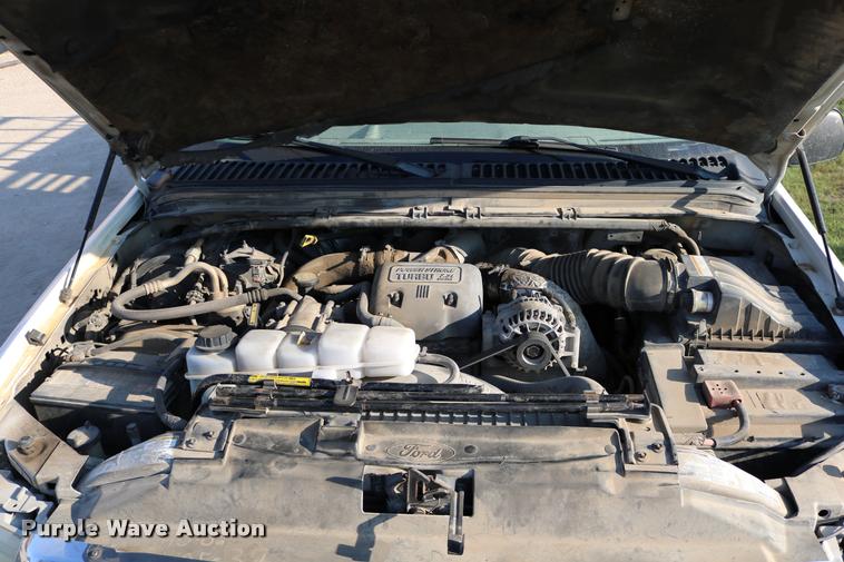 image for item DD0196 1999 Ford F350 Super Duty Crew Cab flatbed pickup truck